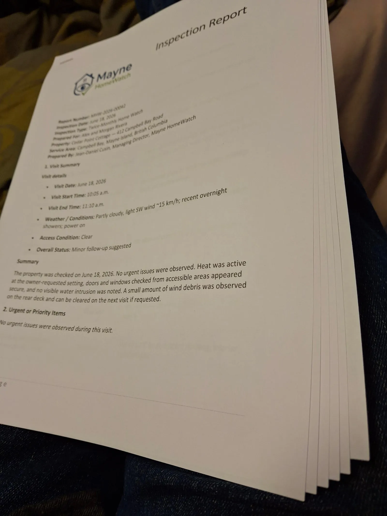 A printed Mayne HomeWatch inspection report with visit summary and checklist notes.